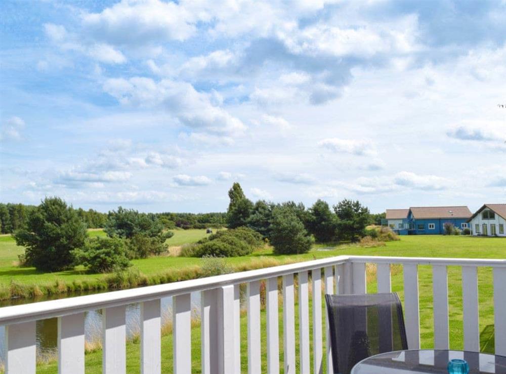 Balcony with lovely views of the golf course at Pine View in Fritton, near Great Yarmouth, Norfolk