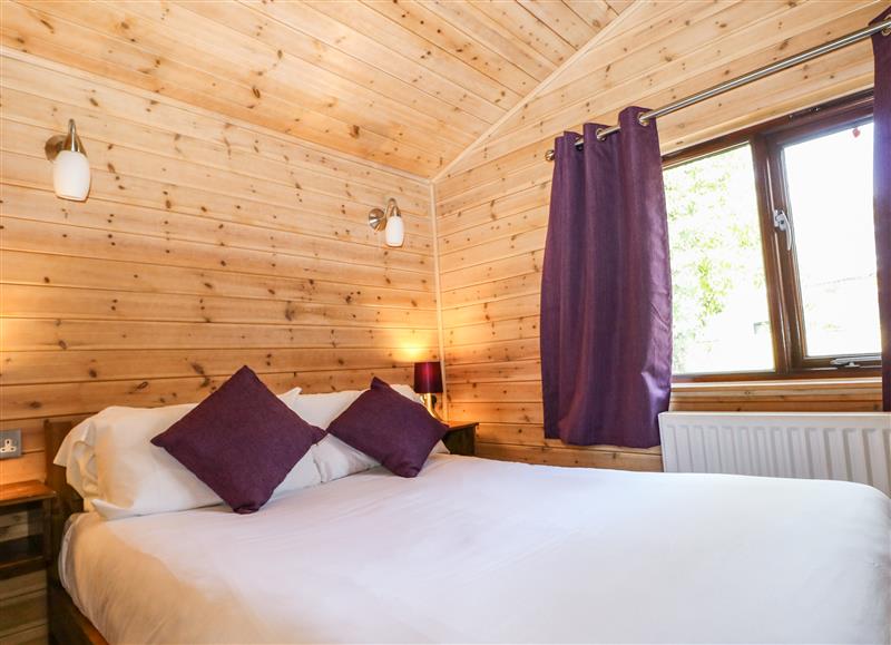 A bedroom in Pinecone Cabin at Pinecone Cabin, Godshill