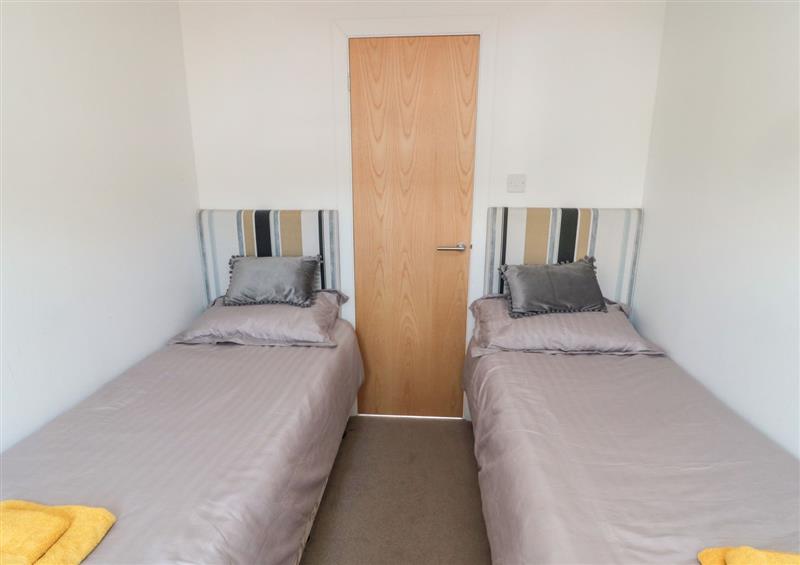 This is a bedroom at Pinecone Lodge - No 9, Felmoor Park near Felton