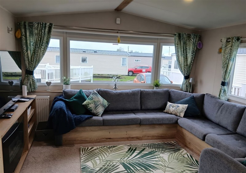 Relax in the living area at Pines 15, Porthcawl
