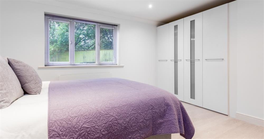 A bedroom in Pines View No.1 at Pines View No.1 in Sandbanks