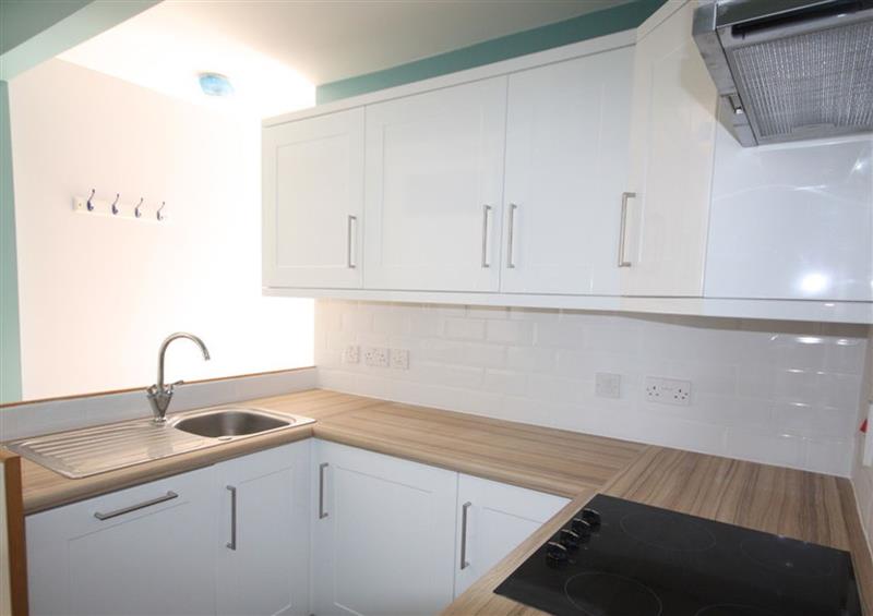 This is the kitchen at Pinewood Flat 5, Polzeath