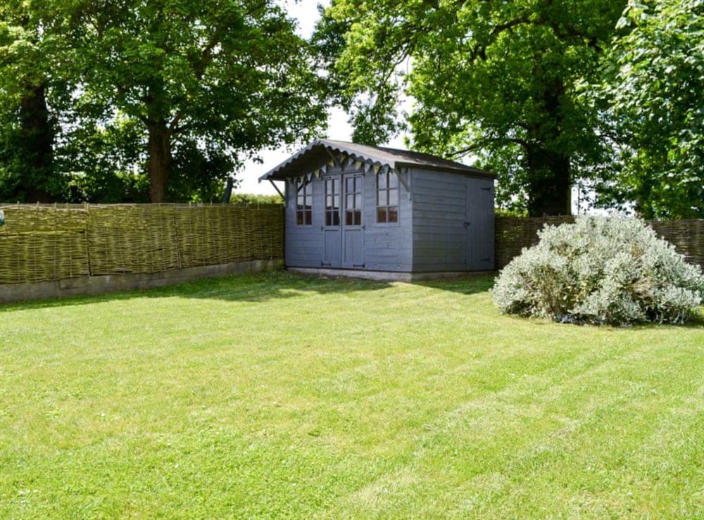 Large enclosed garden at Pink Cottage in Egmere, near Wells-next-the-Sea, Norfolk