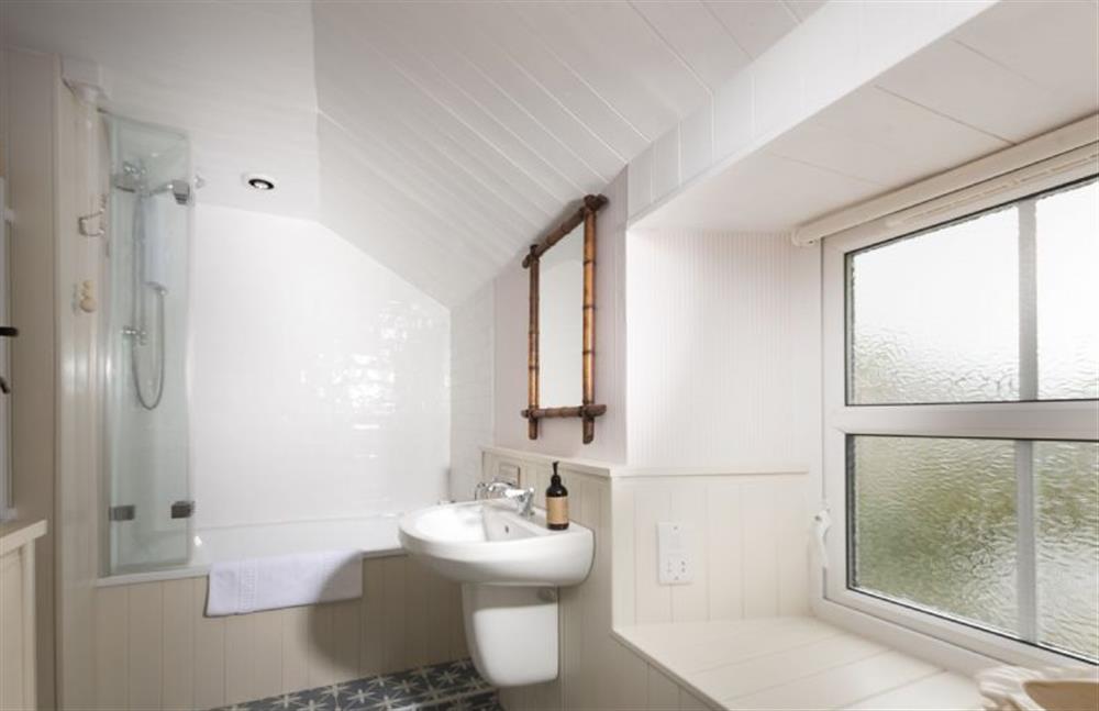 Bathroom with show over bath, wash basin and WC at Pink Cottage, Penzance