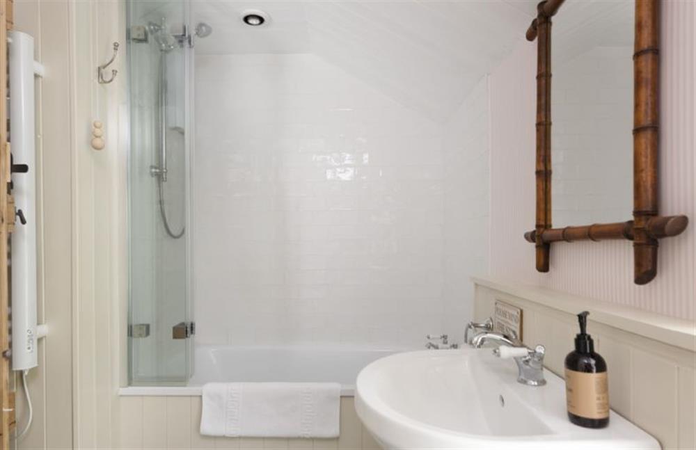 Bathroom with shower over bath at Pink Cottage, Penzance