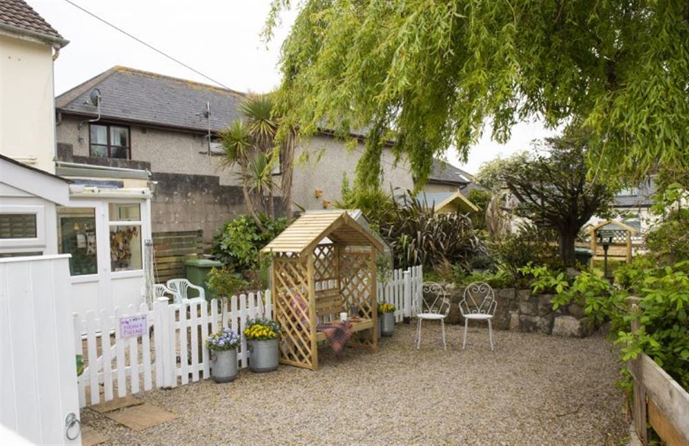 Garden with furniture, summerhouse and charcoal barbecue  at Pink Cottage, Penzance