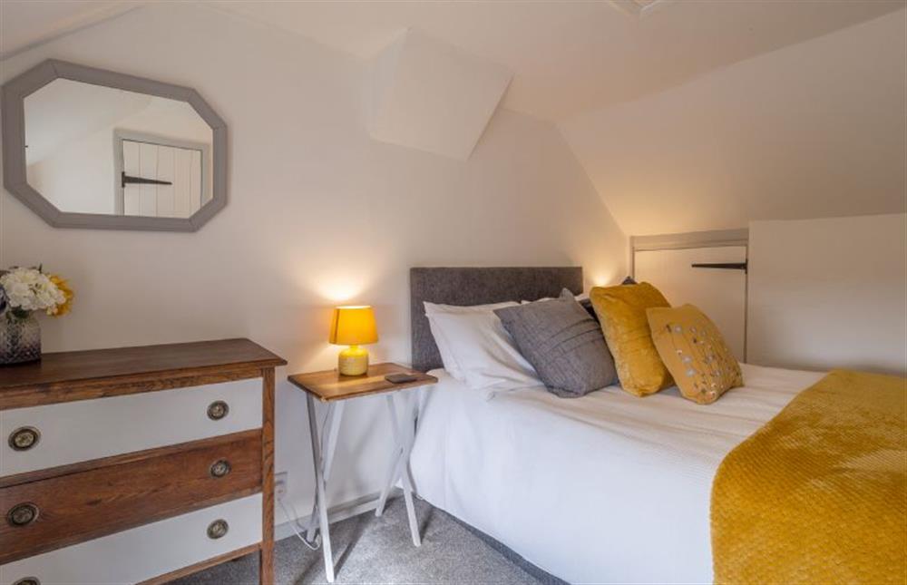 Tastefully furnished master bedroom at Pink Cottage, Stradbroke