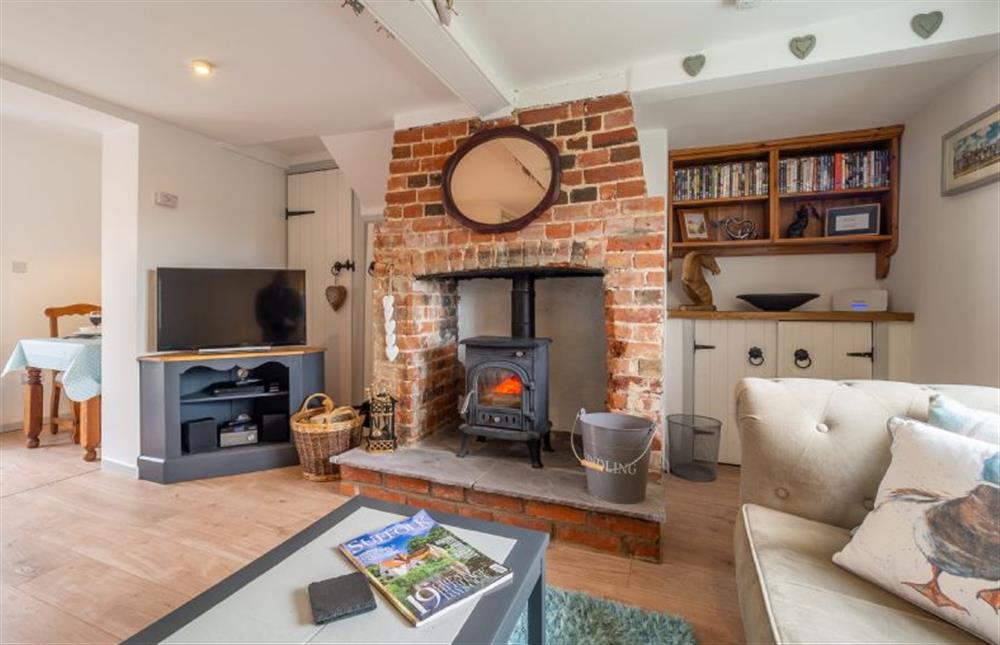 Wood burning stove, ideal for cosy nights in at Pink Cottage, Stradbroke