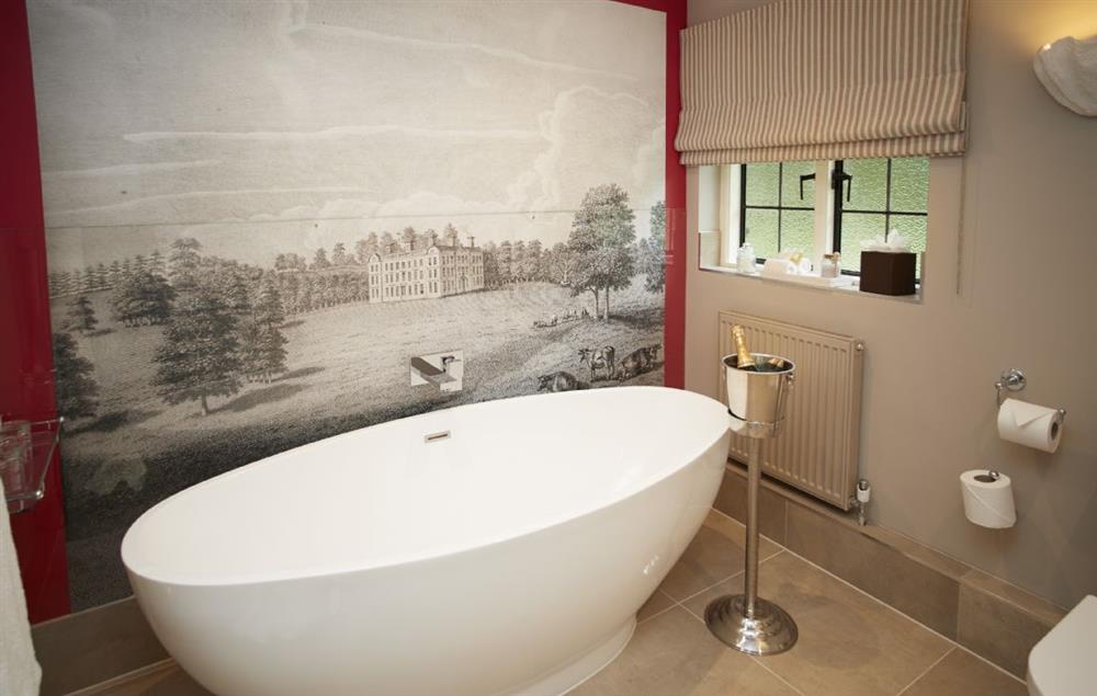 Bathroom with walk in rainforest shower, free standing bath and mural of  Weston Park at Pink Cottage, Weston-under-Lizard Nr Shifnal