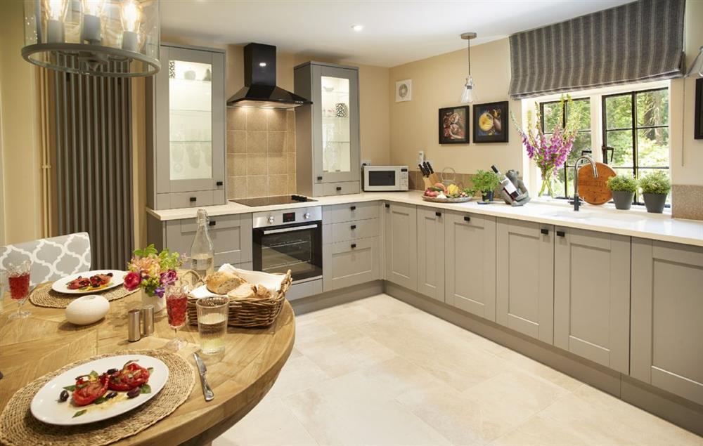 Spacious kitchen with dining table and chairs at Pink Cottage, Weston-under-Lizard Nr Shifnal