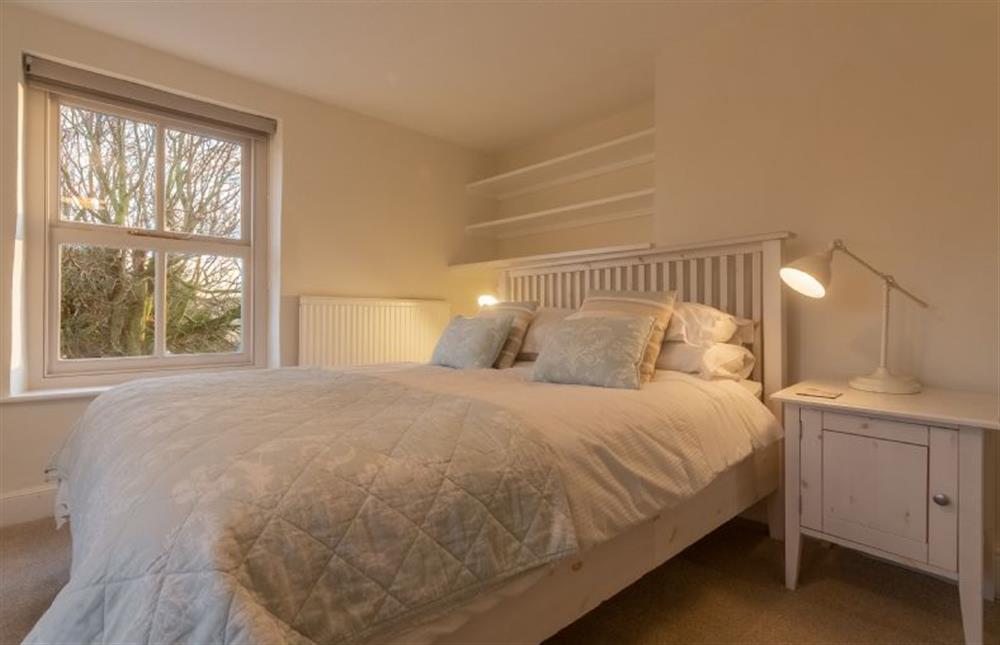 First floor: Master bedroom with king-size bed at Pink End, North Creake near Fakenham