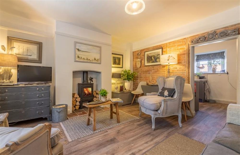 Ground floor: Sitting room has wood burning stove at Piper Cottage, Holme-next-the-Sea near Hunstanton