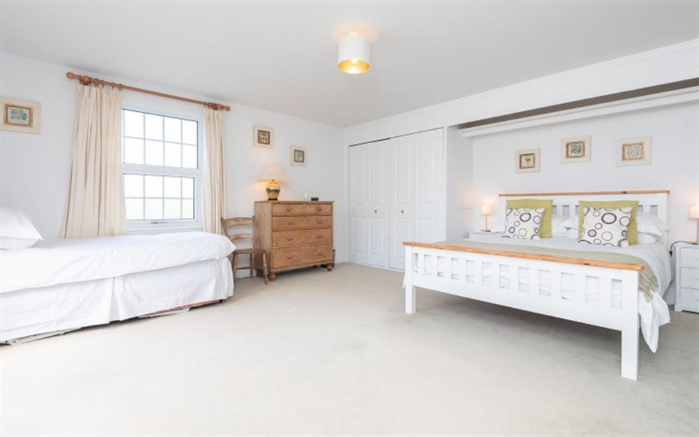 The ground floor double bedroom with extra single bed at Pipers Bench in Thurlestone