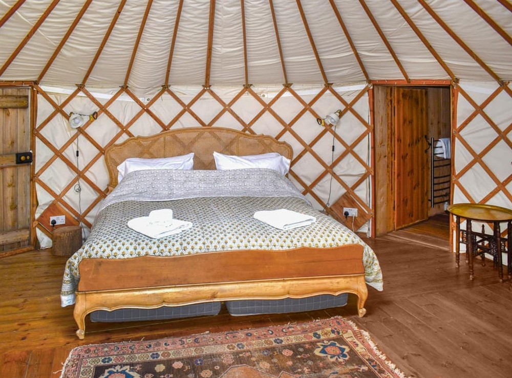 Double bedroom at Pippin Yurt in Beaminster, Dorset