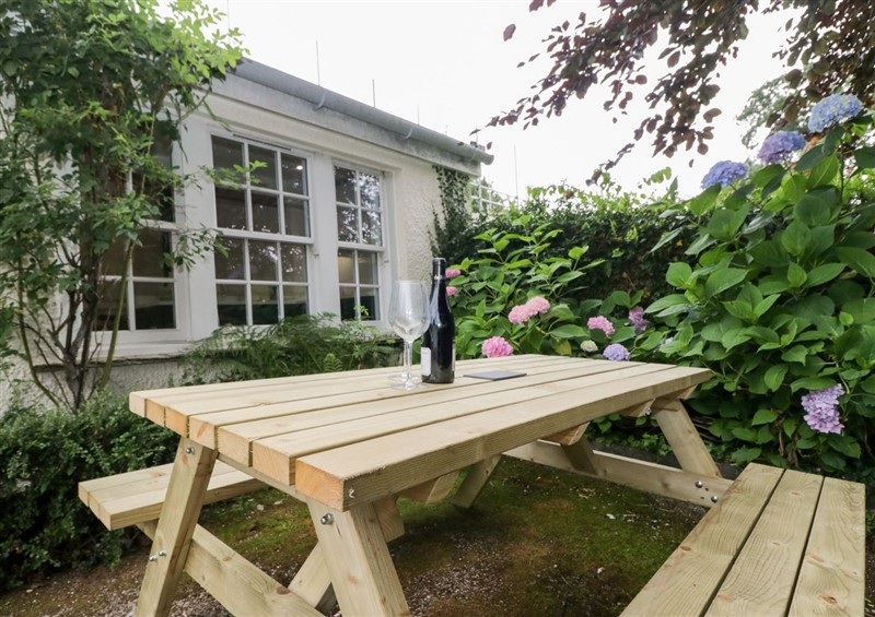 Enjoy a glass of wine on the patio at Pippins, Outgate near Hawkshead