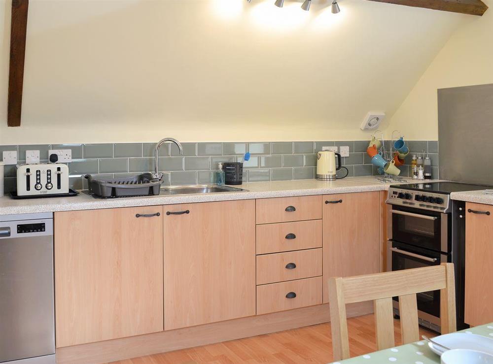 Well equipped kitchen area at Pippins in Penybont, Powys
