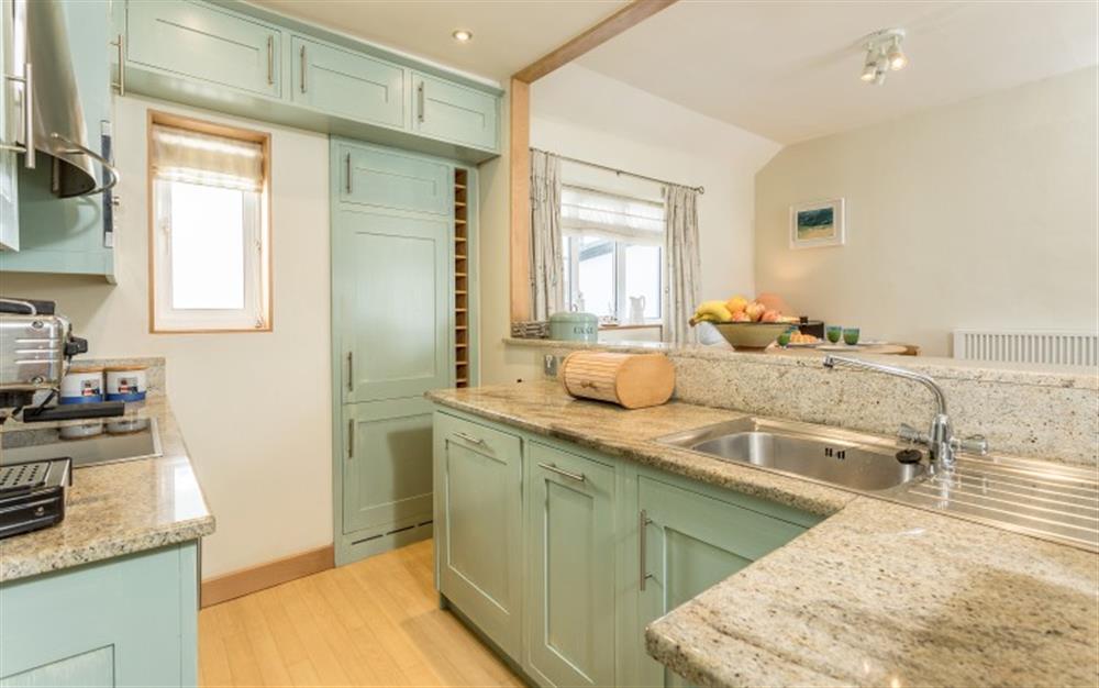 The galley kitchen is fully equipped, with full size appliances. at Pirates Den in Helford Passage