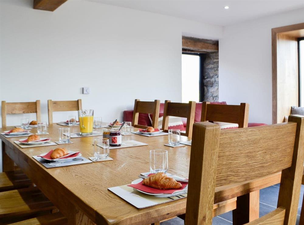 Large dining table and chairs at Pistyll Gwyn in Llanwrthwl, near Rhayader, Powys