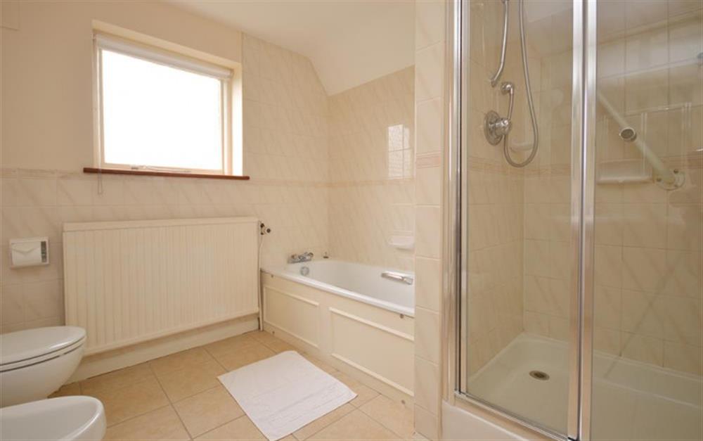 Large first floor family bathroom with separate shower cubicle at Pittefaux Cottage in Brockenhurst