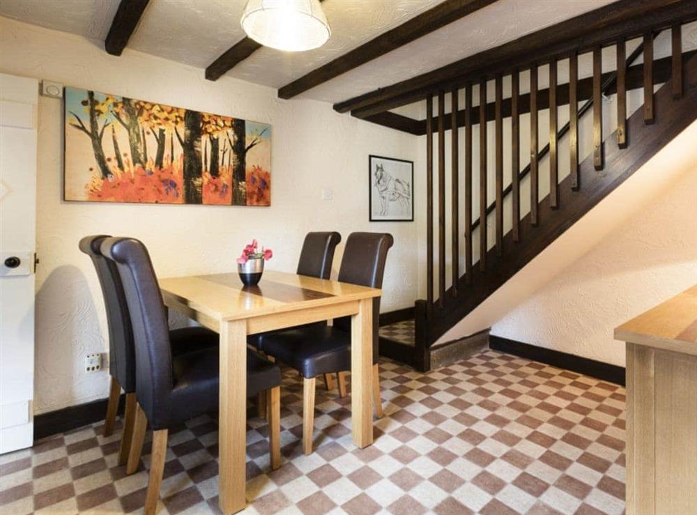 Lovely dining area and stairway to first floor at Pitts Cottage in Brancaster, Norfolk., Great Britain