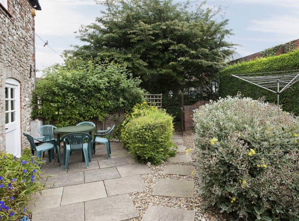 Peaceful garden with patio (photo 2) at Pitts Cottage in Brancaster, Norfolk., Great Britain