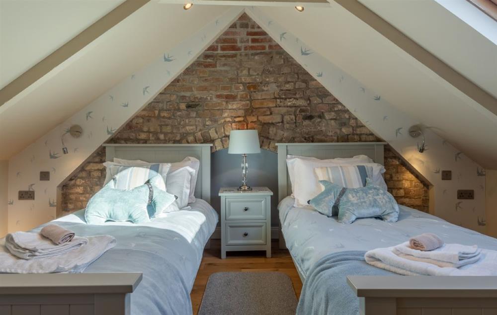 Charming twin beds on the top floor with pitched roof at Place View, Fowey