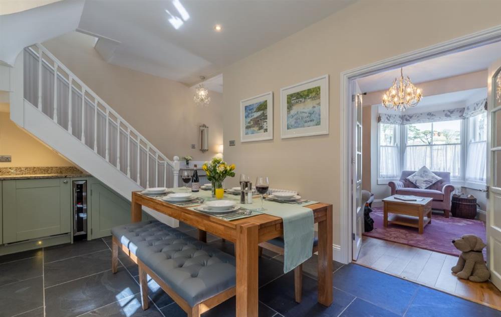 Dining table, french doors leading into sitting room and stairs to first floor at Place View, Fowey