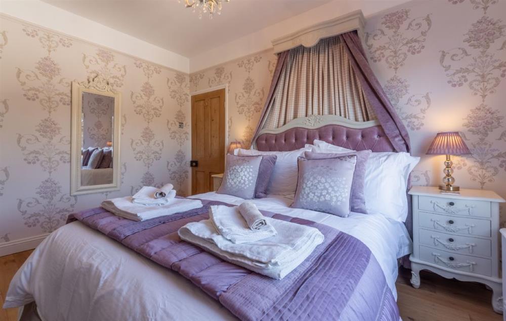 Luxury finishings and calming lighting in the master bedroom at Place View, Fowey