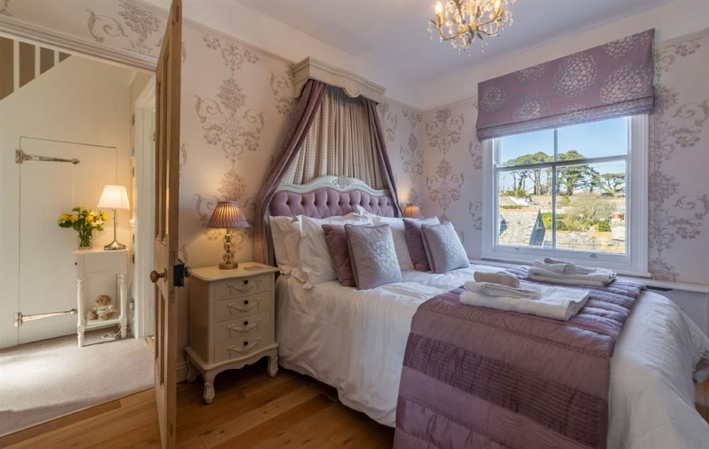 Spacious master bedroom with 4’6 double bed and stunning estuary views at Place View, Fowey