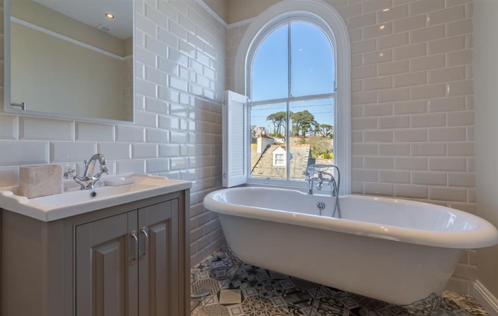 Stunning bathroom with roll top bath and views of the estuary at Place View, Fowey
