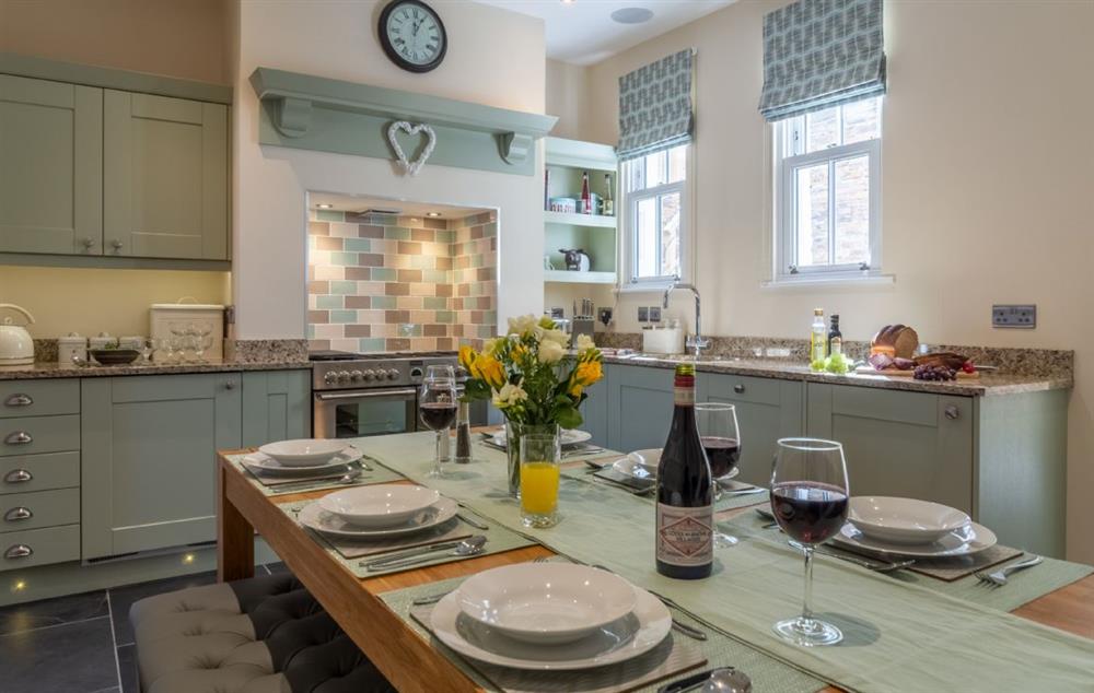 The fully equipped kitchen and dining room at Place View, Fowey