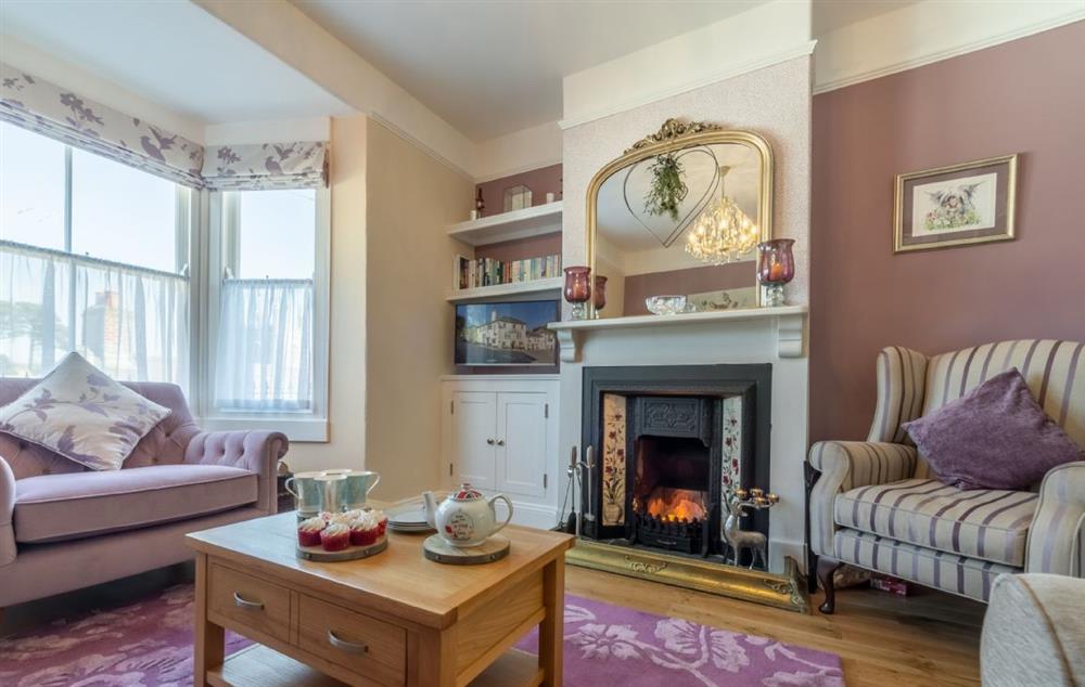 The spacious and elegant sitting room with open fire at Place View, Fowey
