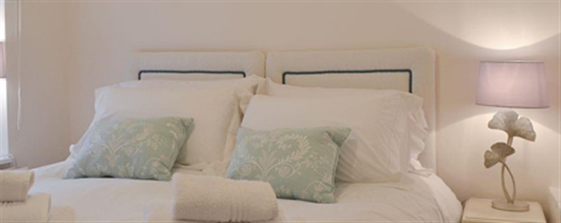 This is the bedroom at Plas Cottage, Llanfaelog