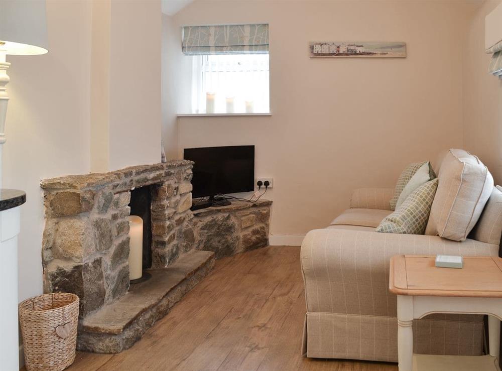 Open plan style living space at Plas Cottage in Rhosneigr, near Holyhead, Gwynedd