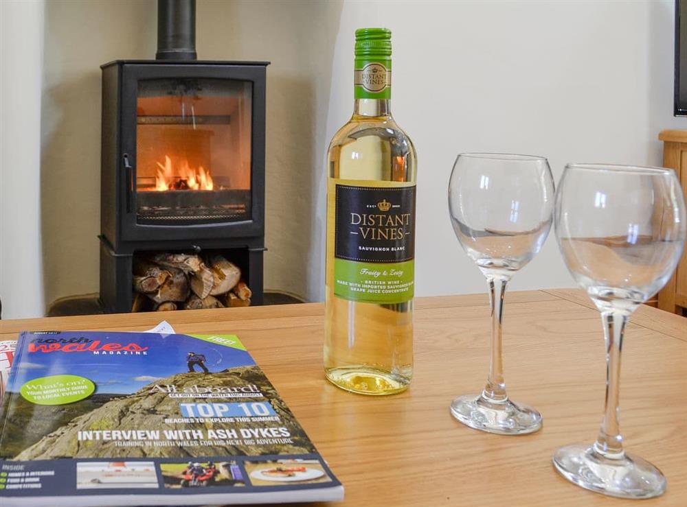 Relax in front of the cosy wood burner at Cruck Barn, 
