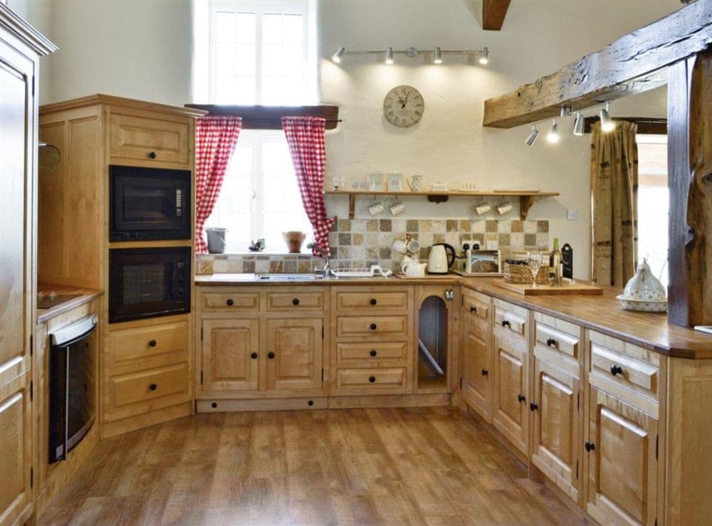 Open plan living/dining room/kitchen at Plas Iwrwg Granary in Maenan, near Llanrwst, Gwynedd
