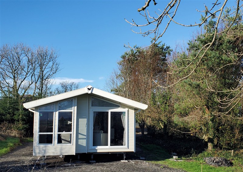 This is the setting of Plas Marchog Lodge at Plas Marchog Lodge, Rhoscefnhir near Pentraeth