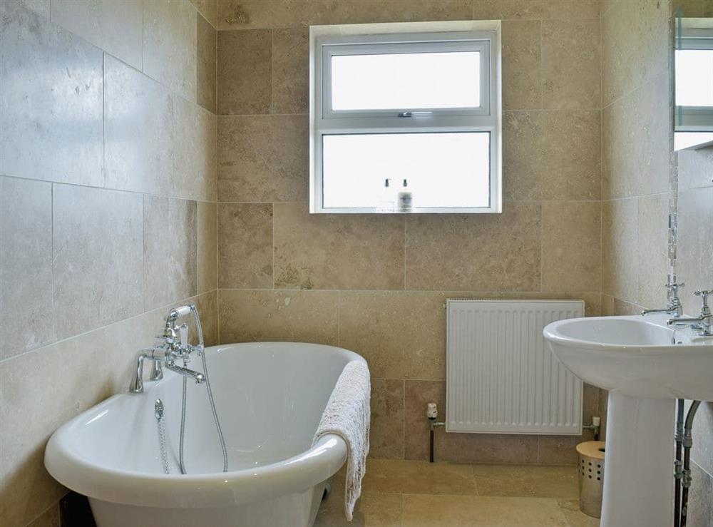 Bathroom with roll top bath at Pleasant Valley in St Florence, Pembrokeshire, Dyfed
