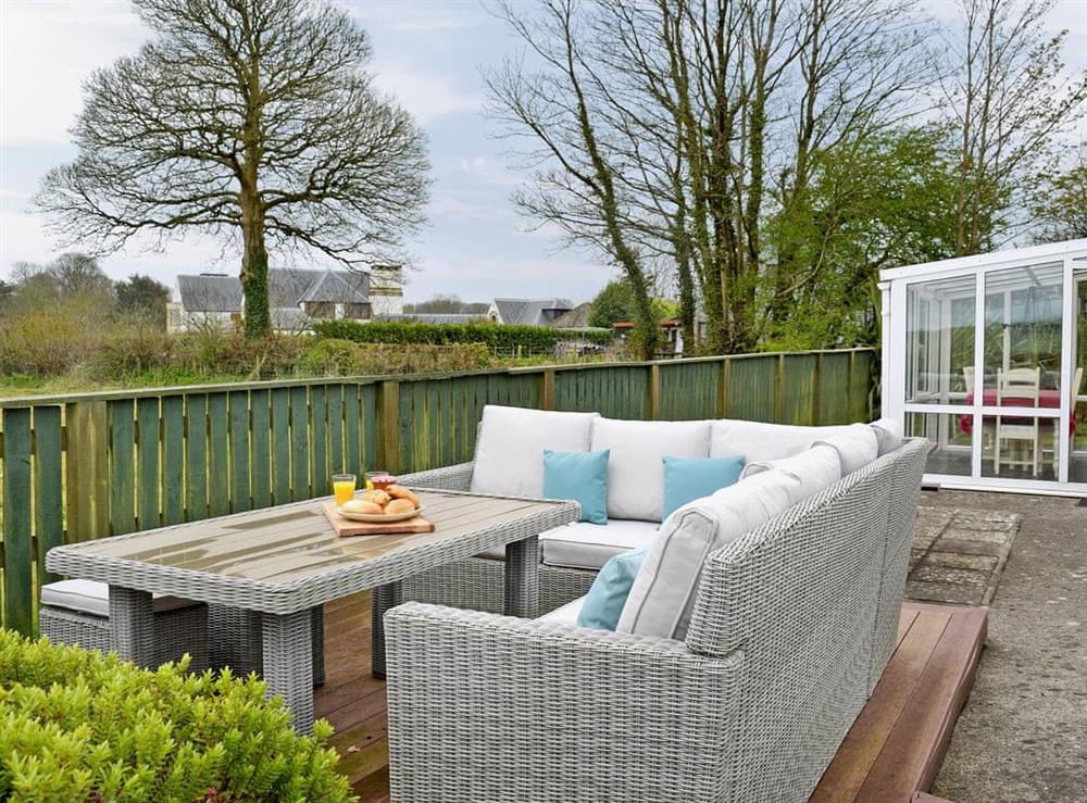 Large enclosed lawned garden with decking at Pleasant Valley in St Florence, Pembrokeshire, Dyfed