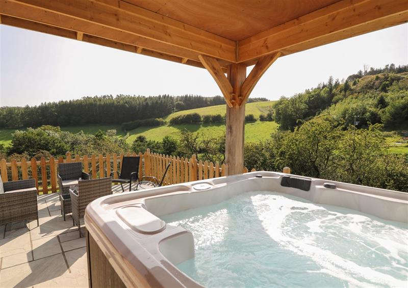 Relax in the hot tub at Ploony Hill Cabin, Bleddfa near Knighton