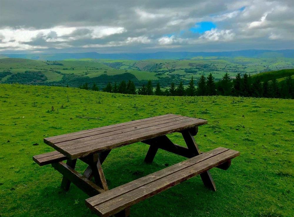 Picnic bench on the walk behind Plough Cottage at Plough Cottage in Machynlleth, Powys