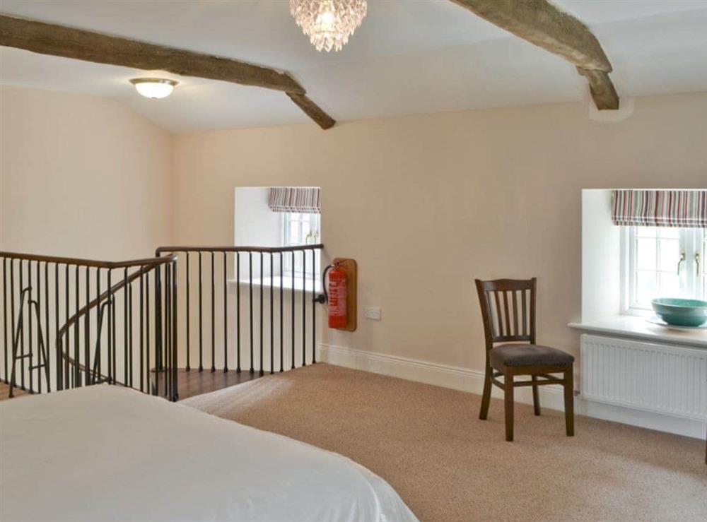 Double bedroom is situated at the top of the spiral staircase at Plover Cottage in Sharperton, near Rothbury, Northumberland