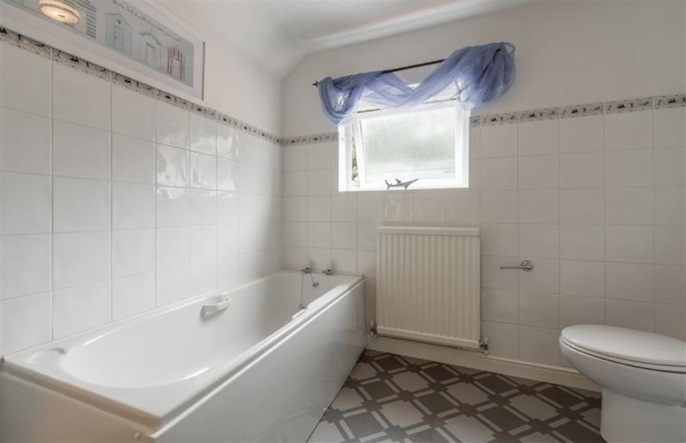 First floor: En-suite with bath, walk-in shower, WC and wash basin