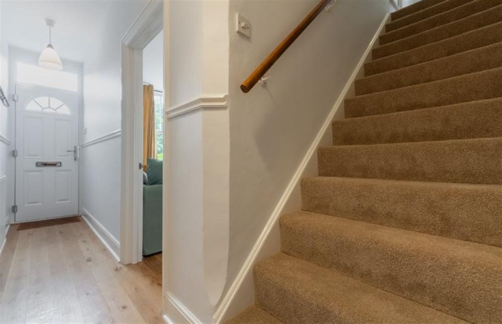 Ground floor: Hallway and stairs to the first floor at Plum Cottage, Overstrand near Cromer