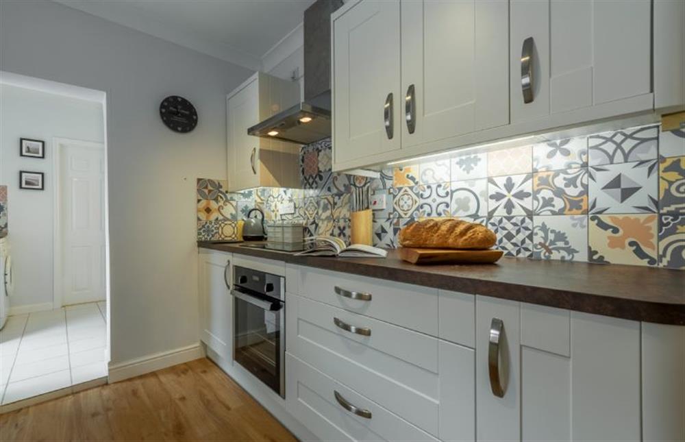 Ground floor: Kitchen looking into utility at Plum Cottage, Overstrand near Cromer