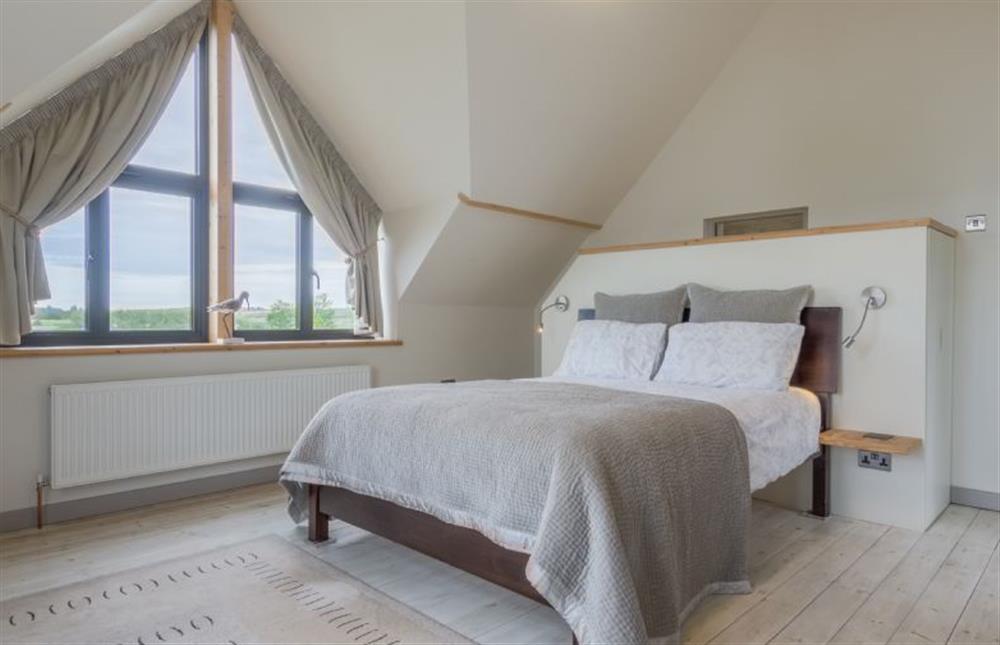 First floor: Master bedroom with King-size bed at Plumtrees, Thornham near Hunstanton