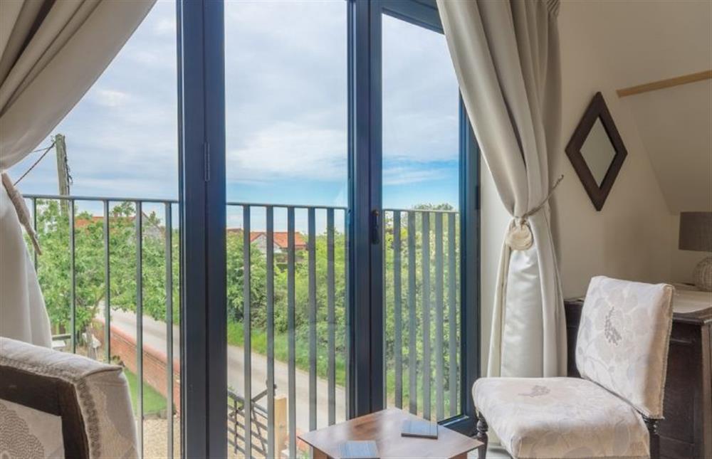 First floor: Master bedroom with superb views at Plumtrees, Thornham near Hunstanton