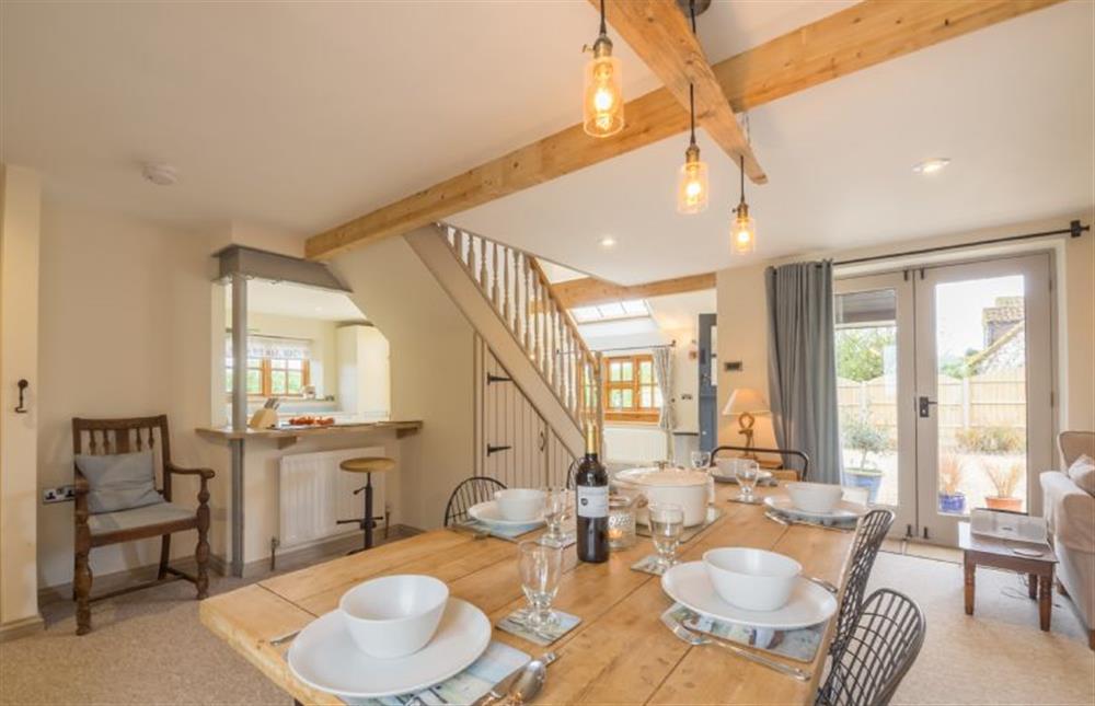 Ground floor: Dining area with large table at Plumtrees, Thornham near Hunstanton