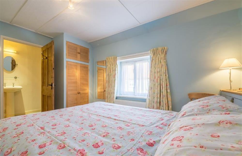 First floor: The Master bedroom has an en-suite Shower room at Plunketts Cottage, Brancaster near Kings Lynn