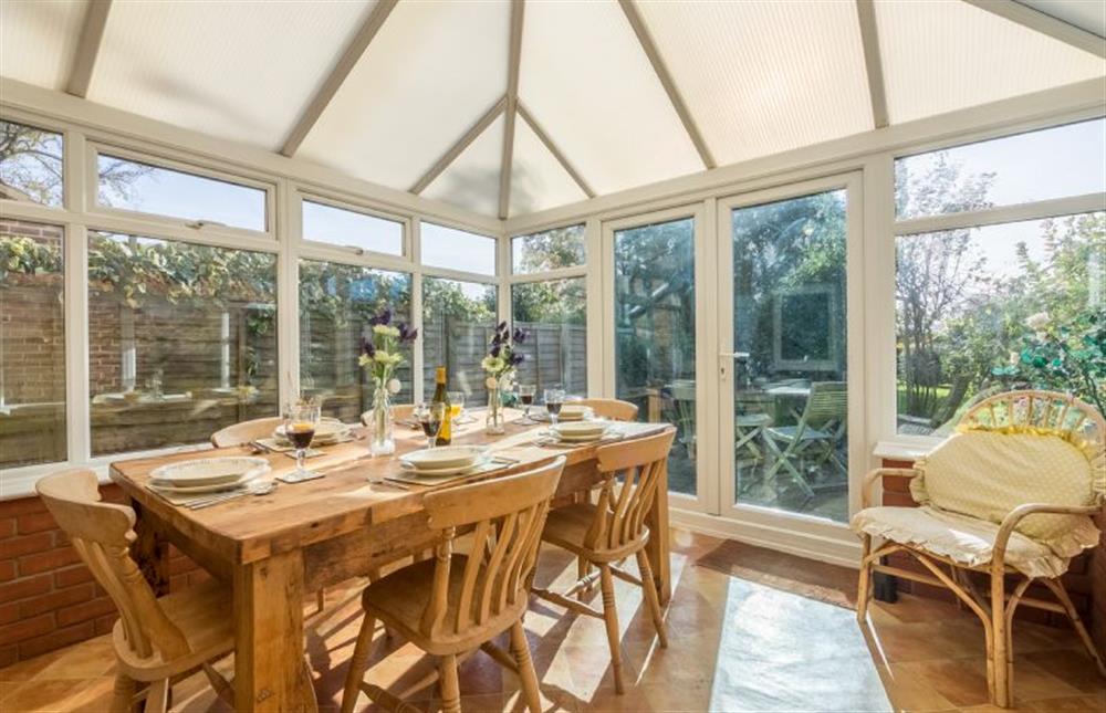 Ground floor: The Conservatory makes a lovely dining area at Plunketts Cottage, Brancaster near Kings Lynn
